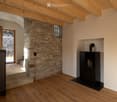 wooden floor, wooden ceiling, stone wall, fireplace, glass door