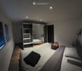 Modern bedroom with a large bed, a wardrobe with mirrored doors, and a backpack on the bed.