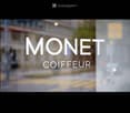 Blurred image with text overlay reading "MONET COIFFEUR" on a street scene background.