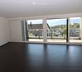 empty room, large sliding glass doors, balcony, wooden floor, white walls