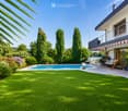 Well-maintained garden with a swimming pool, green lawn, tall trees, and a modern house with a balcony and outdoor seating area.