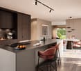 Modern kitchen with dark cabinets, a central island, and a dining area. Features include a coffee machine, sink with a modern faucet, bar stools, a round dining table with chairs, and a framed picture on the wall.