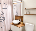 Modern bathroom with a white sink, wooden cabinet, mirror, and toilet. Features a sleek faucet, wooden shelves, and a decorative shower curtain.