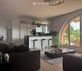 {"visible_features": ["View"], "type": "Furnished Room", "objects": ["sofa", "coffee table", "stool", "kitchen cabinet", "microwave", "stool", "stool", "stool", "stool", "stool", "stool", "stool", "stool", "stool", "stool", "stool", "stool", "stool", "sto