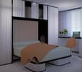 Modern bedroom with a large bed, a sleek black headboard, a modern chair, a desk with a laptop, and potted plants on the windowsill.
