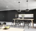 The image shows a modern, minimalist kitchen and dining room. The kitchen features black cabinets and a large window, while the dining area has a wooden table with black chairs. The room has a concrete ceiling with recessed lighting, and there is a dishwa