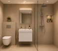 Modern bathroom with beige tiles, a floating sink, a toilet, a glass-enclosed shower, and a large mirror with built-in lighting. Includes a towel, a small plant, and decorative items on shelves.