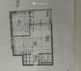 Floor plan of a residential building showing multiple rooms including living room, kitchen, bedrooms, bathrooms, and a balcony.