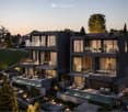 Modern two-story house with large windows, balconies, and a swimming pool in the garden area.