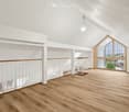 empty room, wooden flooring, white walls, white railings, stairs, glass window, window on roof