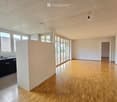 Open floor plan, wooden floor, sliding doors, balcony, kitchen with sink