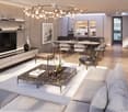 Modern living room with a large sectional sofa, coffee table, fireplace, dining area with a round table and chairs, and an open kitchen area with cabinets and appliances.