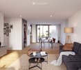 Modern living room with a grey sectional sofa, coffee table, ottoman, floor lamp, dining area with a table and chairs, and decorative items including picture frames and vases.