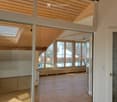 empty room, wooden floor, glass walls, wooden ceiling, skylight, windows