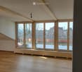 empty room, wooden floor, large windows, view of the outside
