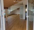 wooden floor, wooden ceiling, large windows, open door