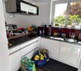 {"type": "Kitchen", "objects": ["refrigerator", "microwave", "blender", "coffee maker", "sink", "cabinets", "countertop", "faucet", "cupboard", "bowl", "bottle", "cup", "bowl", "bowl", "cup", "cup", "cup", "cup", "cup", "cup", "cup", "cup", "cup", "cup",
