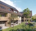 Modern apartment building with solar panels, balconies, garden, and outdoor seating area