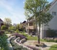 Garden with a tree, bench, flower beds, and a house with a balcony