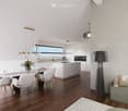 Modern open-plan living and dining area with white cabinetry, a central island, pendant lights, and a sleek dining table surrounded by white chairs. A television is mounted on the wall, and a floor lamp stands nearby.