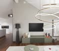 Modern living and dining area with a sleek, multi-tiered circular light fixture, a flat-screen TV mounted on the wall, a tall floor lamp, a kitchen island with bar stools, and a small coffee table with a cup on it.