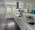 {"type": "Kitchen", "objects": ["sink", "faucet", "coffee maker", "cup", "towel", "cupboard", "fridge", "oven", "kitchen island", "bottle", "cupboard", "faucet", "cup", "cupboard", "cupboard", "cupboard", "cupboard", "cupboard", "cupboard", "cupboard", "c