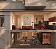 Modern two-story house with open-plan living and dining areas, kitchen, and a fitness area on the lower level. Features include a red sofa, dining table with red chairs, exercise bike, yoga mat, and a sauna.