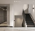 Modern hallway with marble flooring, elevator, staircase, and large windows offering a view of greenery.