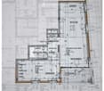 Floor plan of a residential unit showing rooms labeled: Essen (dining), Küche (kitchen), Reduit (storage), Garderobe (hallway), Badezimmer/WC (bathroom), Wohnen (living), Loggia, and Zimmer (bedroom).