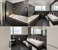 Modern bathroom with dark grey tiles, a large bathtub, double sink, mirror, and a toilet. Features include a glass shower enclosure, wooden bath tray, and small potted plants on shelves.