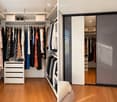 A well-organized walk-in closet with wooden flooring, white walls, and multiple clothing racks, shelves, and drawers. A large mirrored sliding door provides access to the closet.