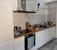 {"type": "Kitchen", "objects": ["oven", "sink", "faucet", "cupboard", "oven hood", "cutting board", "coffee maker", "oven mitt", "oven", "oven", "oven", "oven", "oven", "oven", "oven", "oven", "oven", "oven", "oven", "oven", "oven", "oven", "oven", "oven"