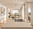 Open-plan living and dining area with a modern kitchen island, pendant lights, and large windows offering a scenic view. The space includes a sofa, dining table, chairs, and various decorative elements.