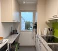 {"type": "Kitchen", "objects": ["microwave", "bowl", "cupboard", "sink", "faucet", "electric kettle", "toaster", "cutting board", "bottle", "oven", "stool", "cupboard", "faucet", "oven", "cupboard", "cupboard", "cupboard", "cupboard", "cupboard", "cupboar