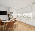 {"type": "Furnished Room", "objects": ["dining table", "chair", "bottle", "vase", "faucet", "sink", "oven", "cup", "faucet", "bottle", "faucet", "faucet", "bottle", "bottle", "bottle", "bottle", "bottle", "bottle", "bottle", "bottle", "bottle", "bottle",