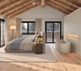 Spacious bedroom with wooden floors, exposed wooden beams, large windows with mountain views, a modern bed, nightstand, bathtub, and floor lamp.