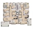 Floor plan of a multi-level house with multiple bedrooms, bathrooms, living and dining areas, kitchen, and hallway.