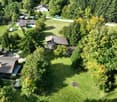 6 separate wooden chalets with terrace, fireplace, surrounded by trees and greenery