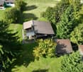2-story house, brown roof, large yard, trees, detached house, small house