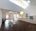 modern kitchen, spiral staircase, dark floor, white walls, hanging lamp