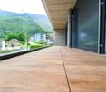 wooden floor, glass railing, open to outside, view of mountains