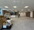 empty room, tiled floor, white ceiling, boxes, ladder, stairs