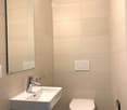 modern bathroom, white sink, silver faucet, white toilet, white tiles