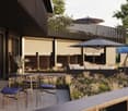 Outdoor terrace, balcony, dining table and chairs, umbrella, view of the mountains, modern architecture, natural landscape, flowers and plants, grass, buildings