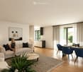 Modern living room with a couch, coffee table, and a dining area with a table and chairs.