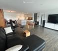 {"type": "Furnished Room", "objects": ["sofa", "coffee table", "chair", "stool", "table", "kitchen island", "fridge", "sink", "faucet", "faucet", "table", "chair", "chair", "chair", "chair", "chair", "chair", "chair", "chair", "chair", "chair", "chair", "