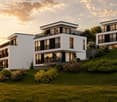 Modern three-story house with white exterior, black accents, large windows, balconies, and landscaped garden.