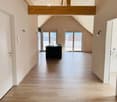high ceiling, wooden floor, open plan kitchen, glass doors