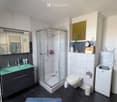 {"type": "Bathroom", "objects": ["sink", "faucet", "mirror", "shower", "toilet", "washing machine", "clock", "cupboard", "towel", "basket", "bottle", "toothbrush", "toothpaste", "soap", "shampoo", "shower gel", "shower cap", "shower gel bottle", "shower g