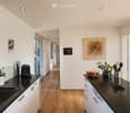 {"visible_features": ["View"], "type": "Kitchen", "objects": ["sink", "faucet", "coffee maker", "bowl", "plant", "utensil holder", "faucet", "faucet handle", "faucet sprayer", "faucet sprayer handle", "faucet sprayer hose", "faucet sprayer sprayer", "fauc
